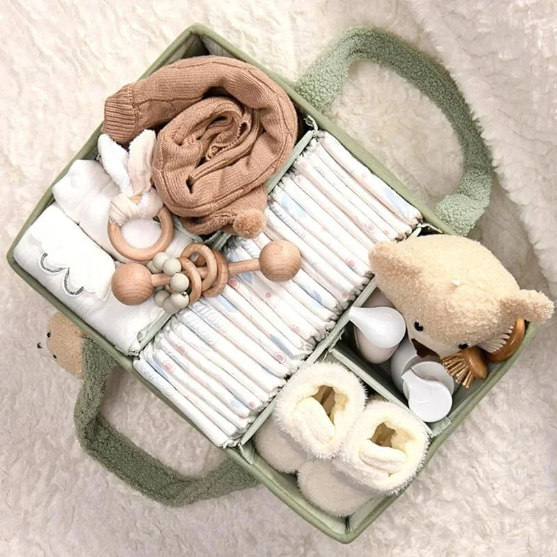 Panier de rangement pour bébé vu de face avec ses poignées